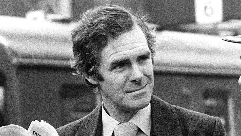 Brian Trueman pictured in 1977 in a shirt and tie in a black and white photograph