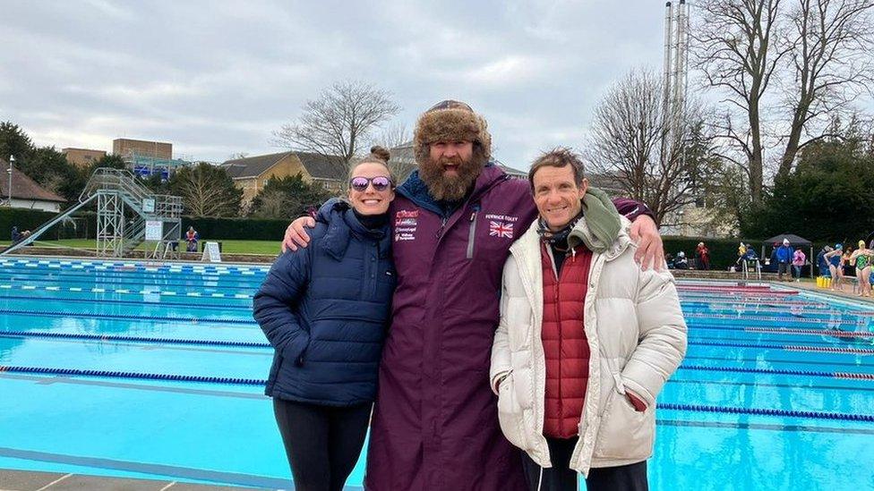 Left to right: Laura Nesbitt, Fenwick Ridley and Simon Griffiths standing in front of the pool