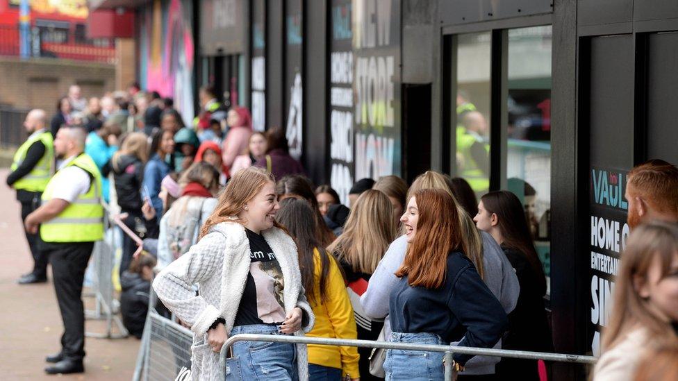 Crowds queue outside to see singer Liam Payne perform at the launch event of the HMV Vault in Birmingham