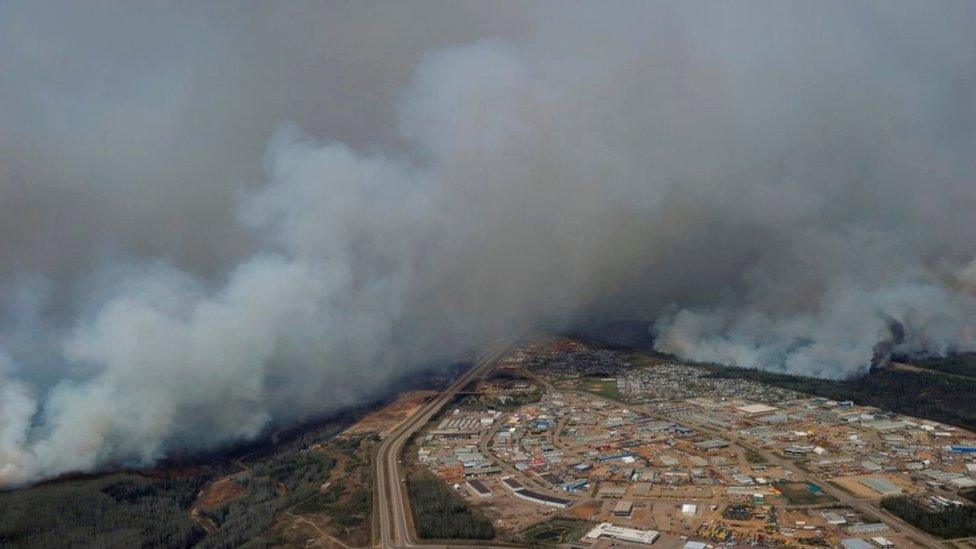 A Canadian Joint Operations Command aerial photo shows wildfires near neighborhoods in Fort McMurray, Alberta