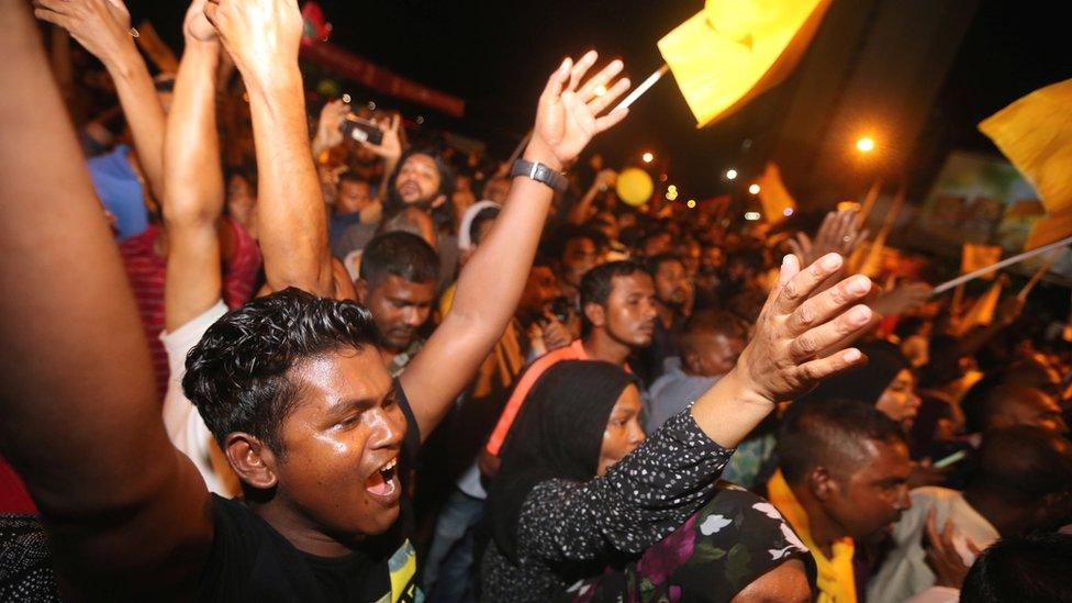 Supporters of Maldivian joint-opposition presidential candidate Ibrahim Mohamed Solih celebrate on the street