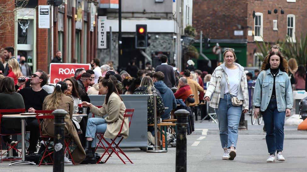 People enjoying restaurants in Stevenson Square in Manchester