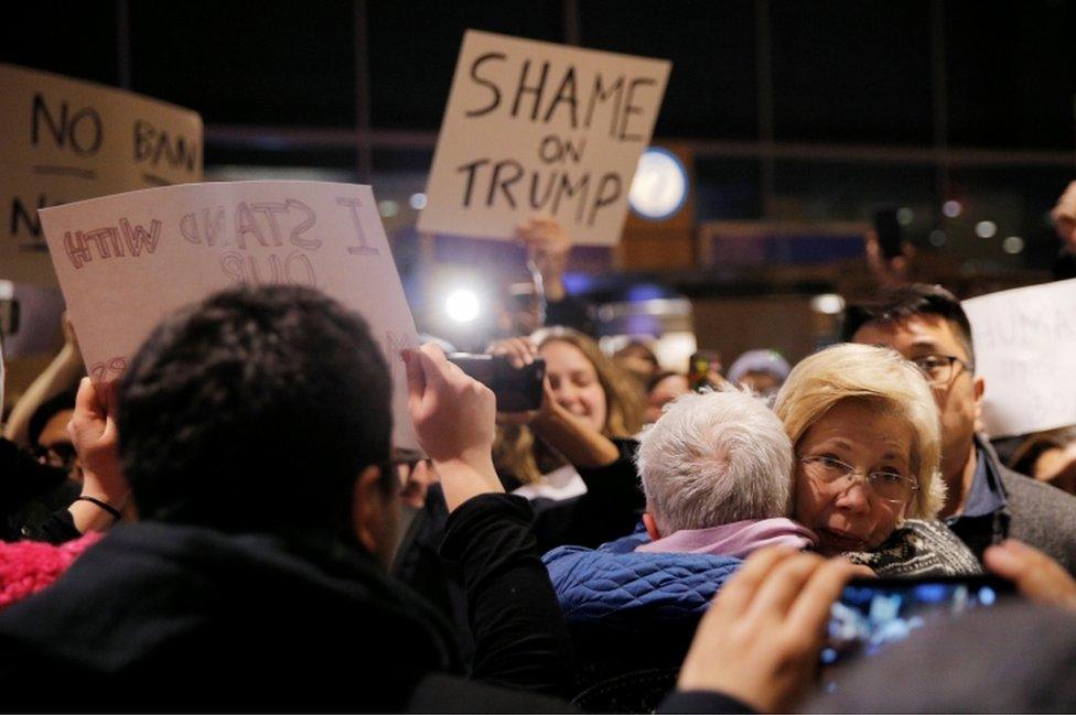 US Senator Elizabeth Warren greets demonstrators protesting against the executive order at Logan Airport in Boston.