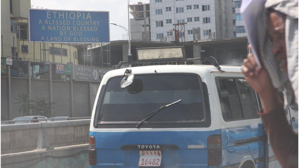 Pedestrians crossing the major thoroughfare of Churchill Road in the centre of the Ethiopian capital, Addis Ababa.