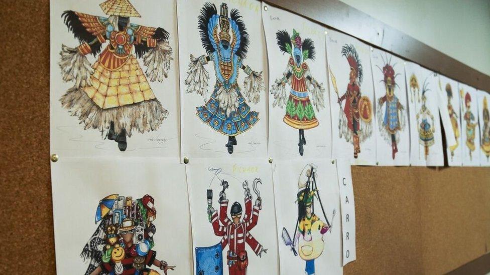 Photograph of sketches of Paraiso do Tuiuti samba school costumes