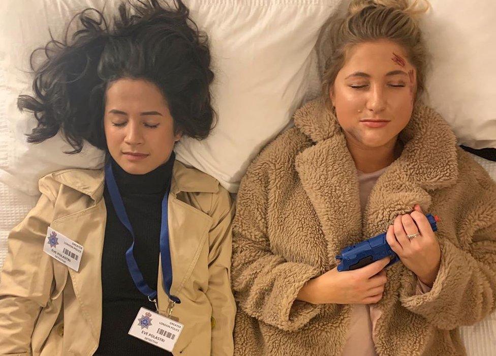 Two people dressed up as Villanelle and Eve Polastri