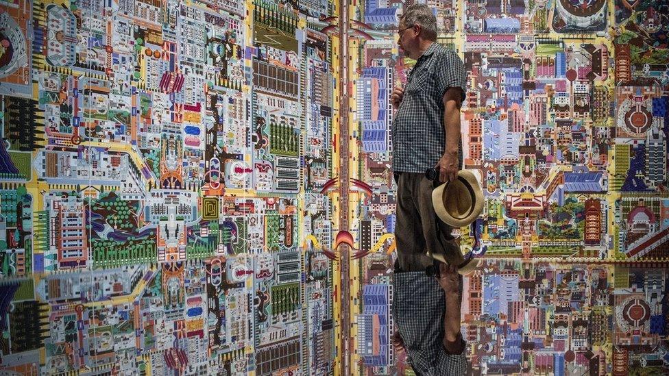 A visitor views the exhibition of China at the 16th Venice Biennale in Venice