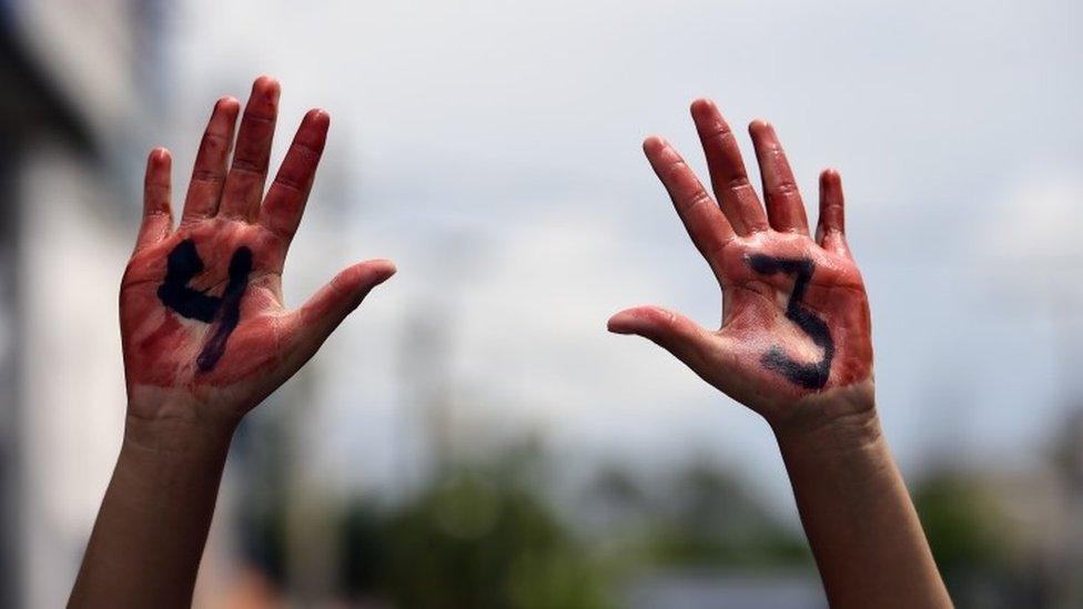 Relatives and friends of the 43 missing students from Ayotzinapa take part in a demonstration in Iguala, Guerrero State, Mexico, on September 27, 2015, to commemorate the first anniversary of their disappearance.