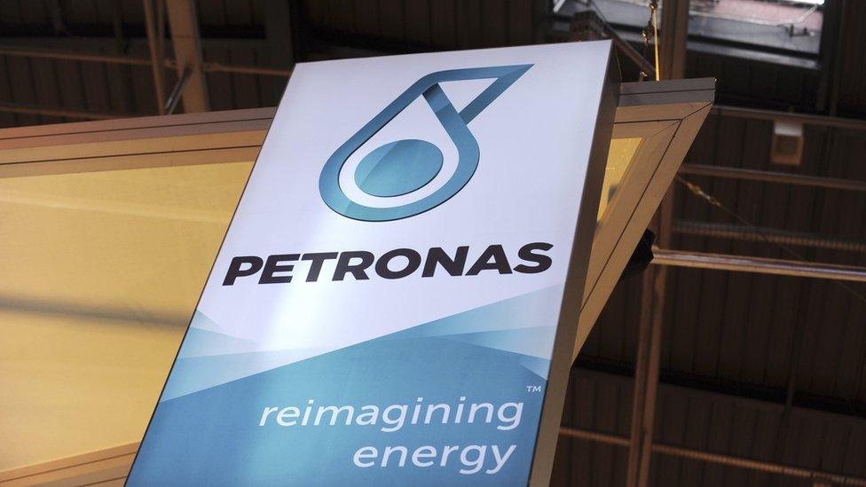 A picture shows the logo of Malaysian state energy firm Petronas during the World Gas Conference exhibition in Paris on June 2, 2015.