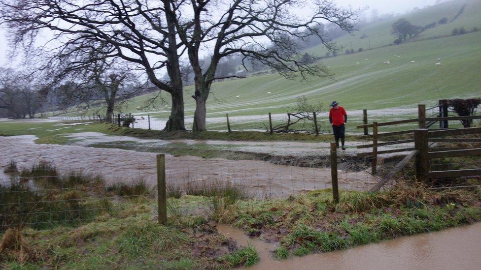 The swollen River Stewi in Penrhyn-coch