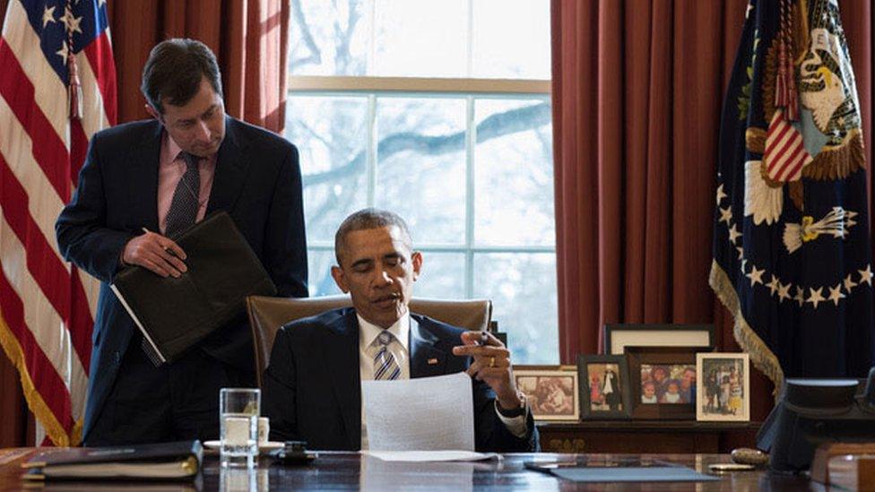 Barack Obama reviews a speech in the Oval Office