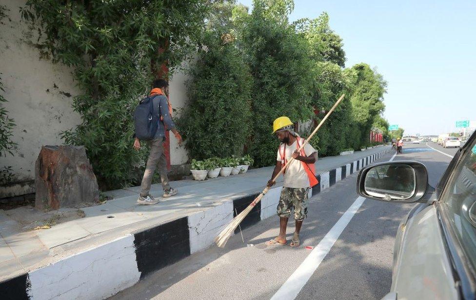 Indian Municipal workers cleans the road as part of the beautification of the city near the airport for the upcoming G20 Heads of State and Government Summit in New Delhi, India, 04 September 2023