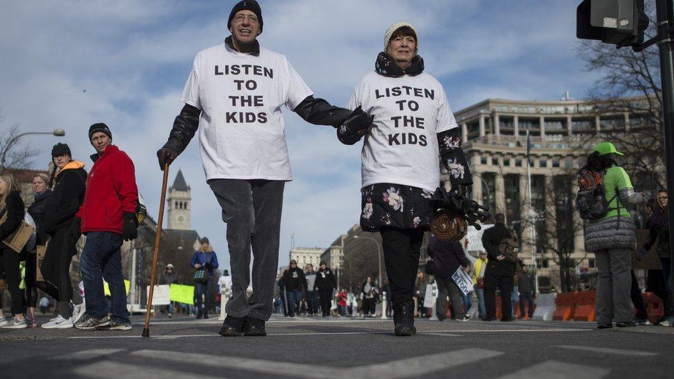 People arrive for the March For Our Lives rally against gun violence in Washington, DC on March 24, 2018.