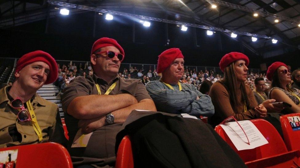 Delegates in red berets