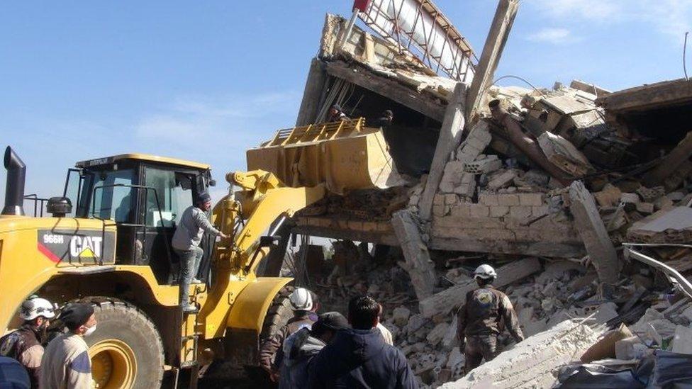 Workmen at the site of the bombed hospital (15 February 2016)