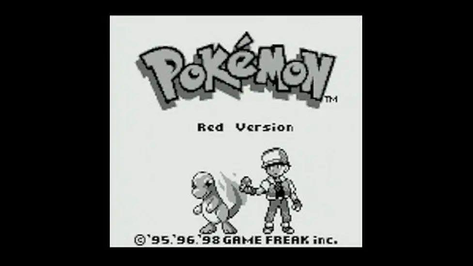 The loading screen from the original pokemon red version game showing ash and charmander.