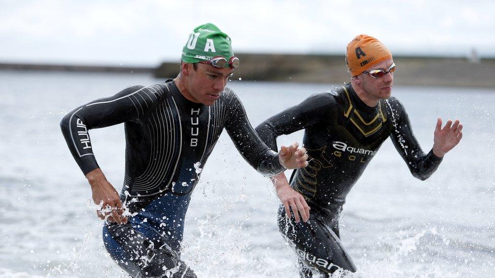 Participants in the water at Roker for the swim leg of the triathlon events