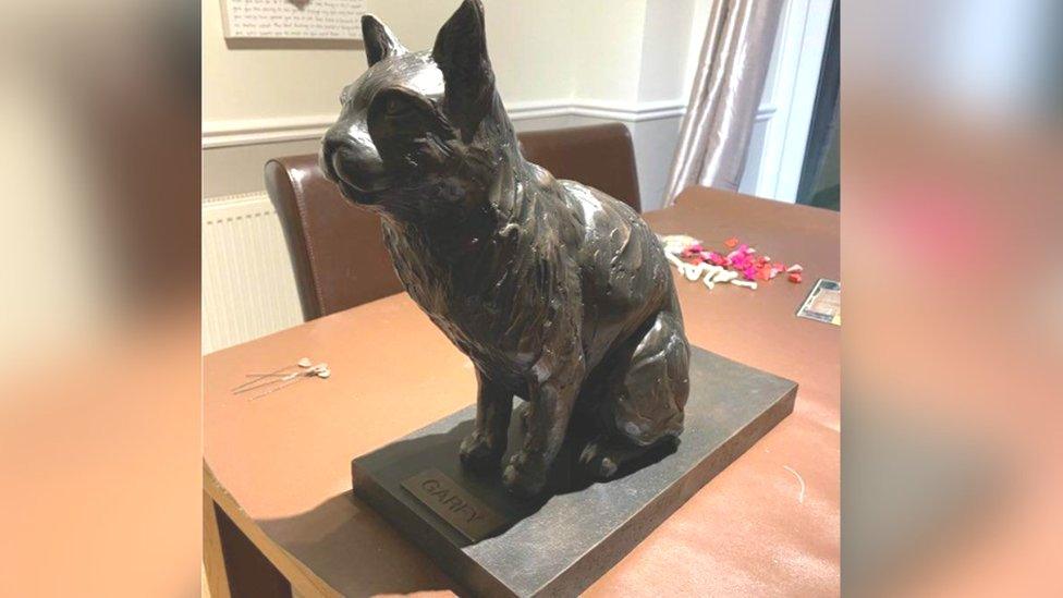 Bronze sculpture of a cat