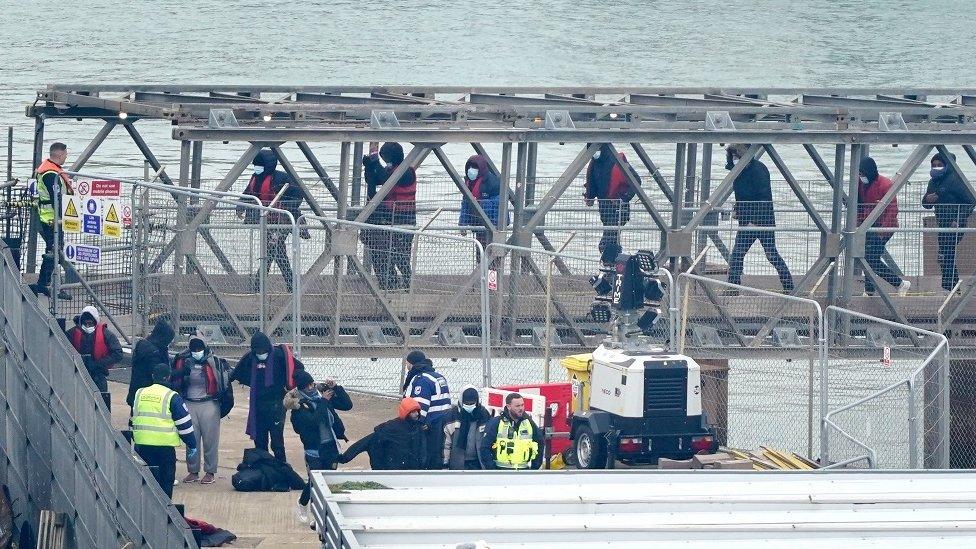 A group of people thought to be migrants are brought in to Dover, Kent, onboard a Border Force vessel following a small boat incident in the Channel