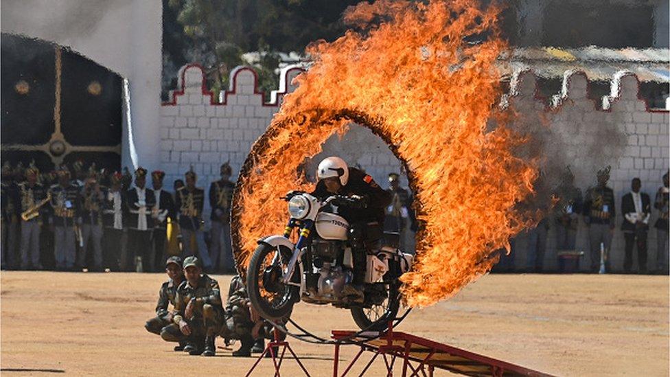 A member of the 'Tornadoes', a motorcycle stunt team belonging to Army Service Corps, performs during celebrations for the India's 74th Republic Day in Bengaluru on January 26, 2023.