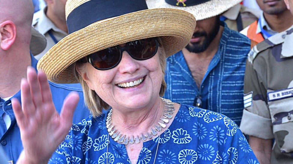 Hillary Clinton waving as she arrives in Jodhpur