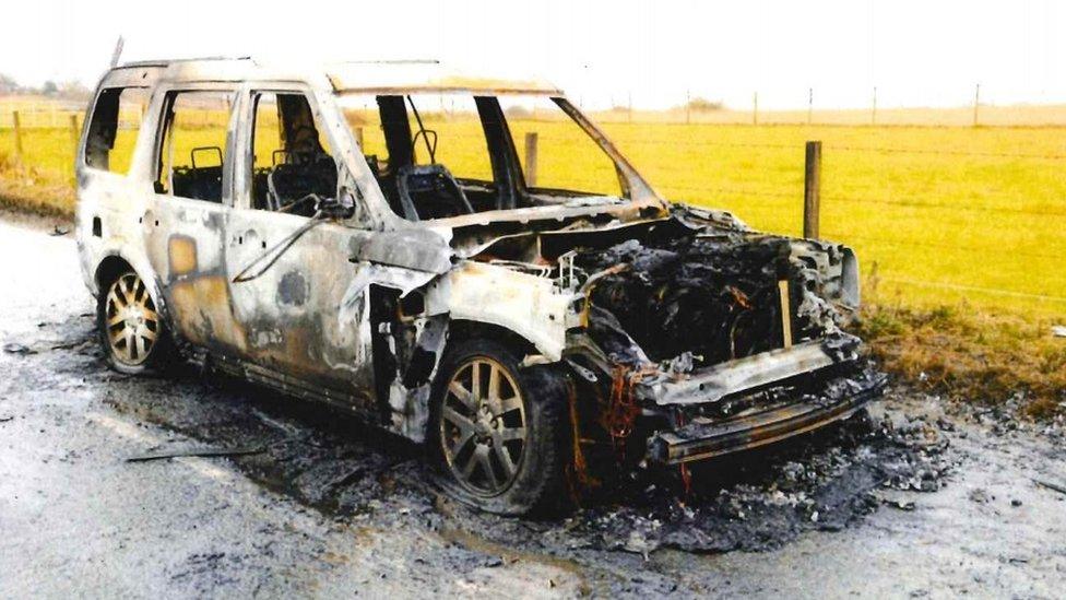 Burnt-out Landrover Discovery