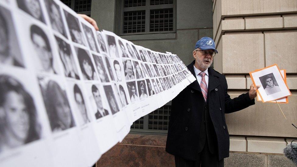 Paul Hudson holds up pictures of the Lockerbie bombing