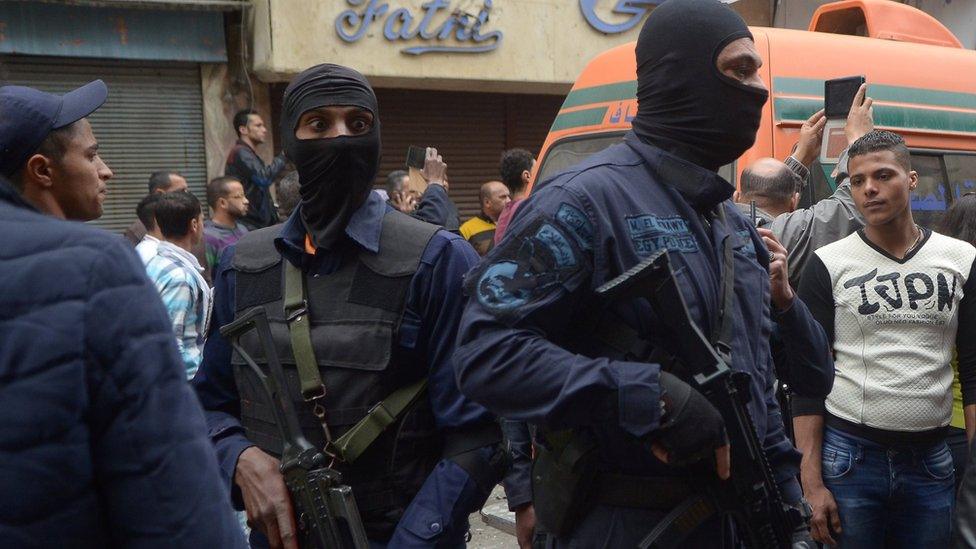 Egypt's special forces members take position after an attack by a suicide bomber in front of a church in Alexandria