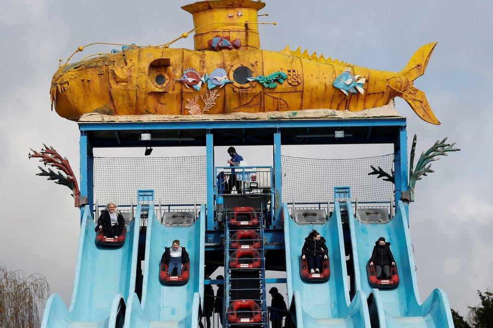 People ride the Depth Charge water slide ride at Thorpe Park