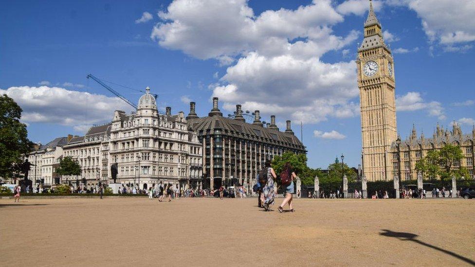 Parliament Square in London- normally green but the long period of hot weather has dried the grass