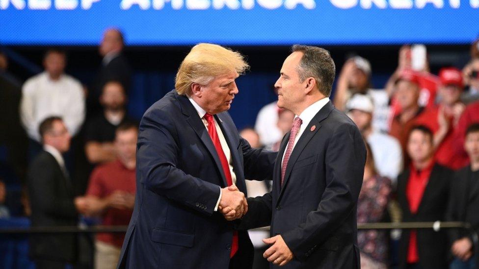 Donald Trump shakes hands with Kentucky governor Matt Bevin during a rally in Lexington, Kentucky