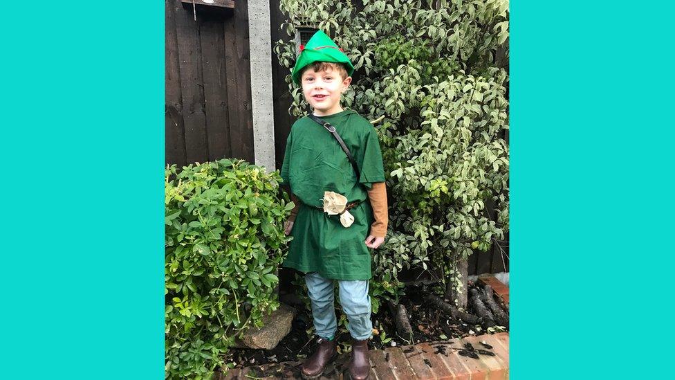 Boy dressed as Robin Hood.