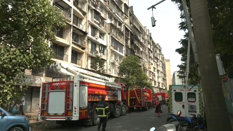 Firefighters at the apartments where the fire broke out