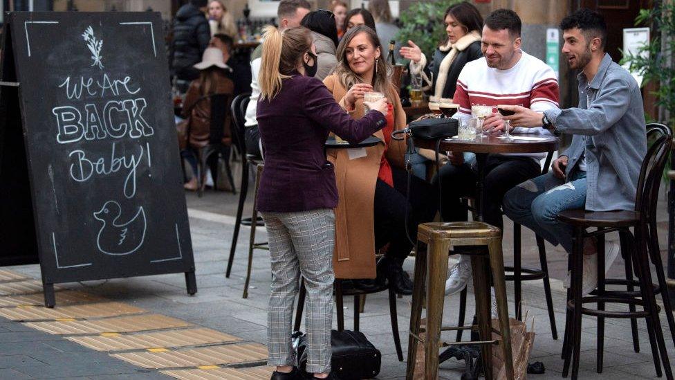 people drinking in a bar