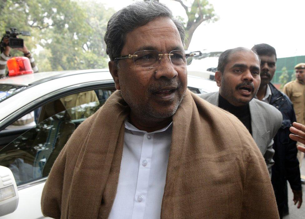 Karnataka chief minister K Siddaramaiah arrives to attend a Congress party meeting in New Delhi on 27 December 2013.