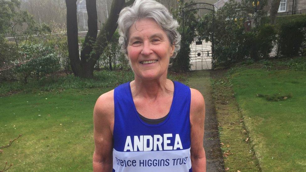 Photo of Andrea Gellan in a garden wearing her London Marathon sash