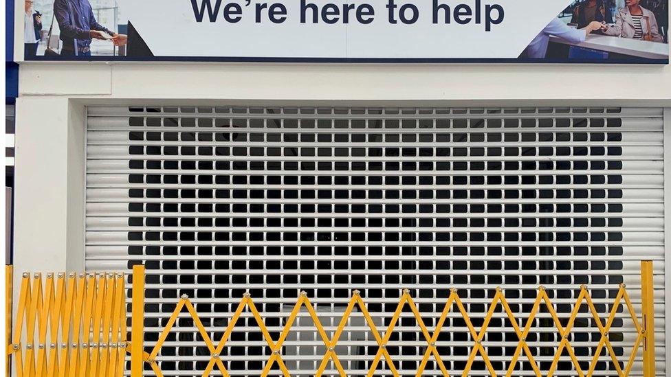 Shutter down over Stansted Airport information desk.