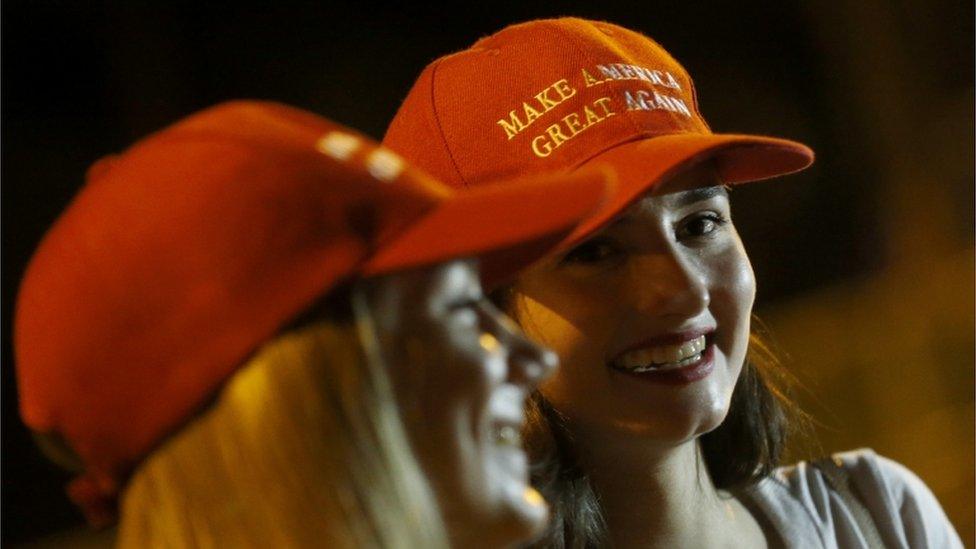 Women wearing MAGA hats