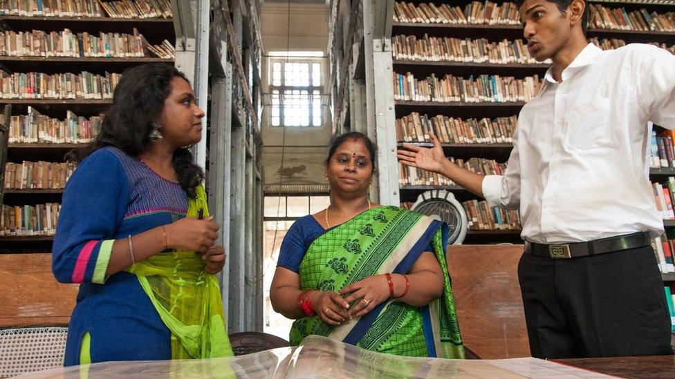 Volunteers Ms. Thirupura Sundari Sevvel (left) and Mr. Rajith Nair in a discussion with the Madras Literary Society librarian Uma Maheshwari