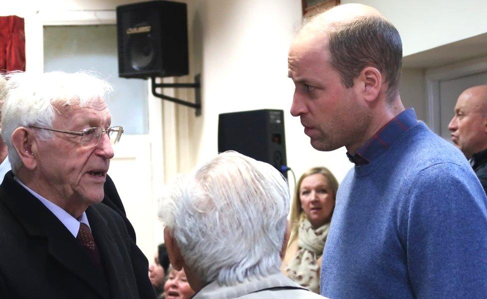 Prince William talking to members of the public