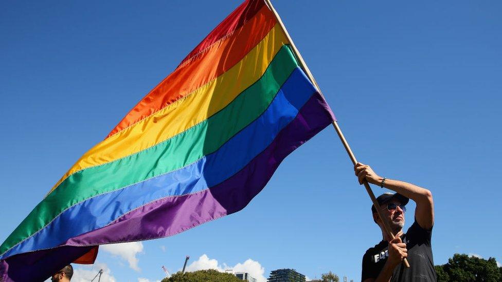 Prominent Sydney artist Chris Lewis proudly flies his much loved Rainbow flag on November 15, 2017 in Sydney, Australia