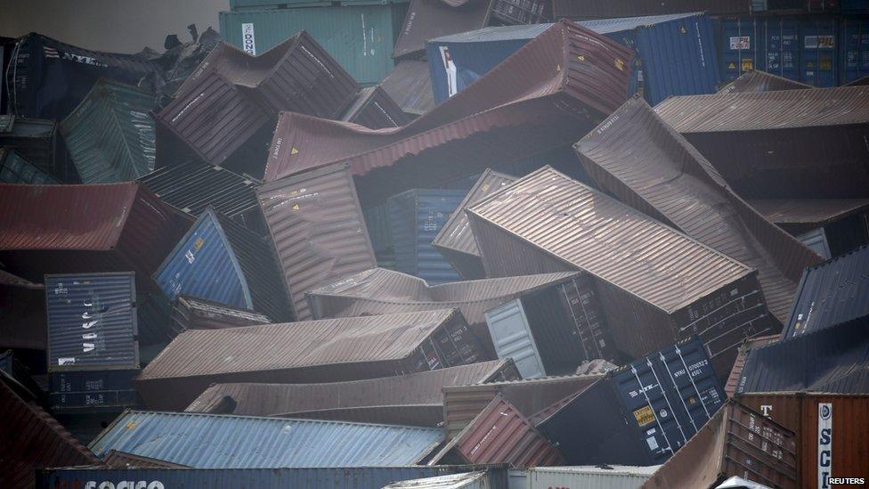 Overturned containers are seen near the site of the explosions at the Binhai new district, Tianjin, August 13, 2015.