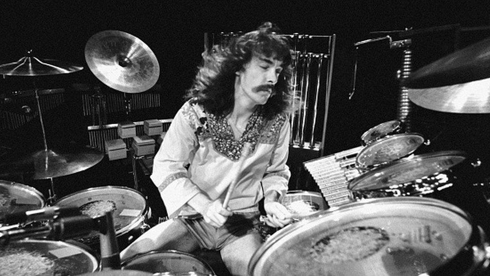 Neil Peart performing live onstage, playing drums at the Odeon on A Farewell To Kings Tour