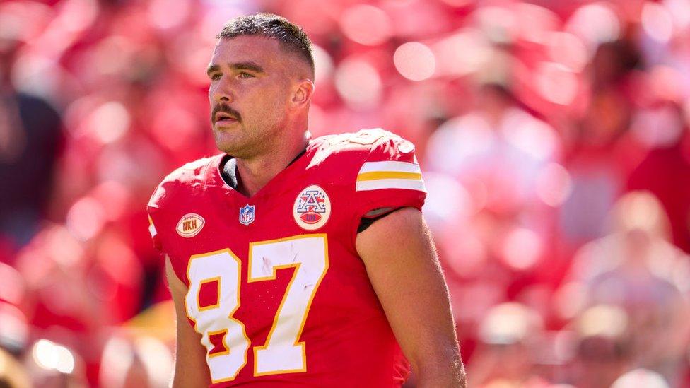 Travis Kelce #87 of the Kansas City Chiefs looks on before kickoff against the Chicago Bears at GEHA Field at Arrowhead Stadium on September 24, 2023 in Kansas City, Missouri.