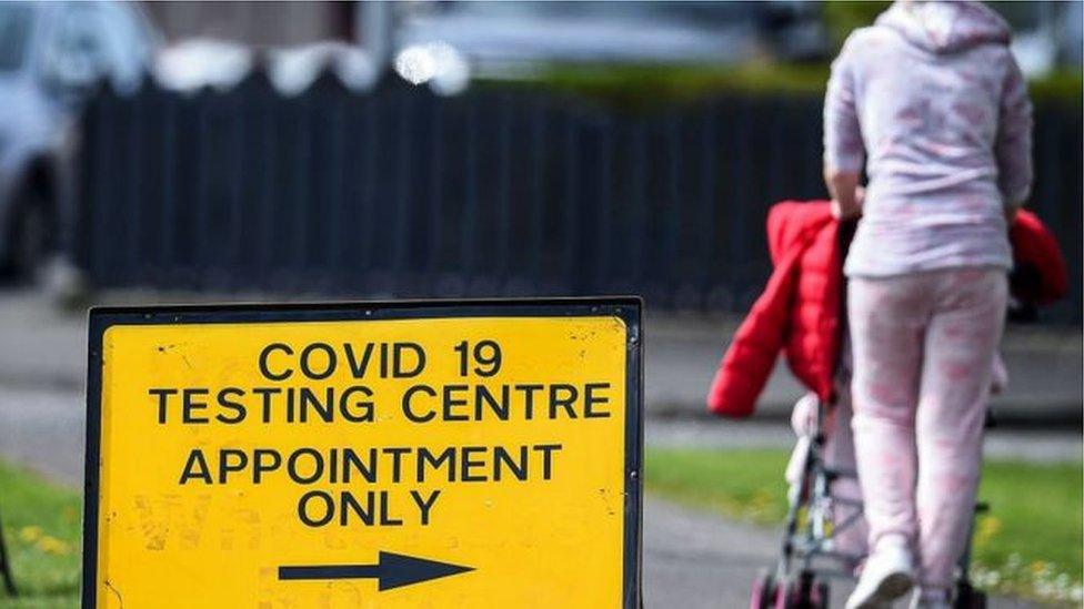 Woman with pram at testing centre