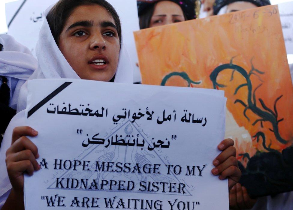 Woman holding a placard at a protest