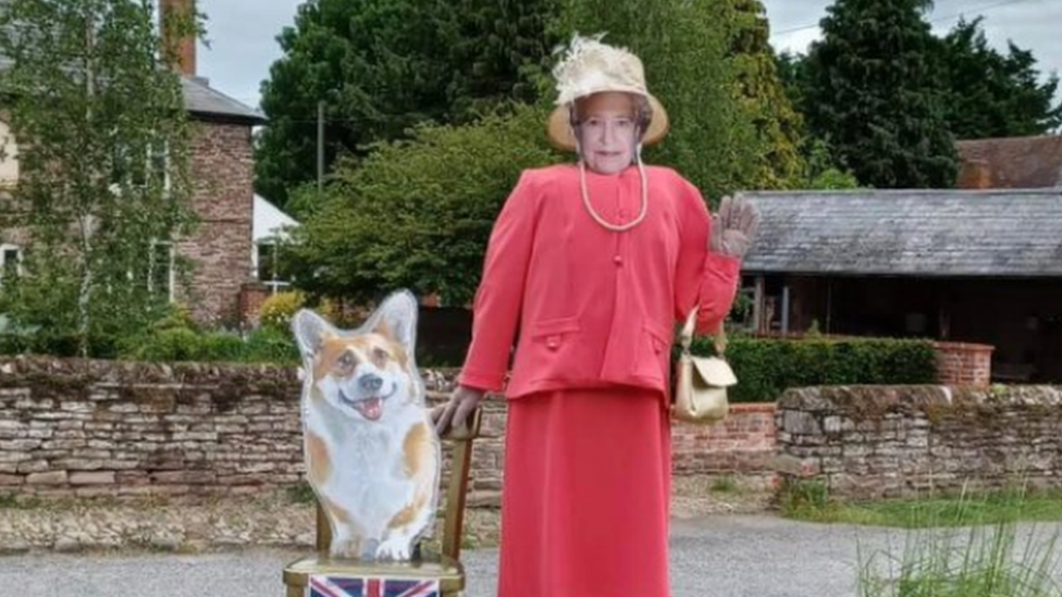 Queen and Corgi scarecrow