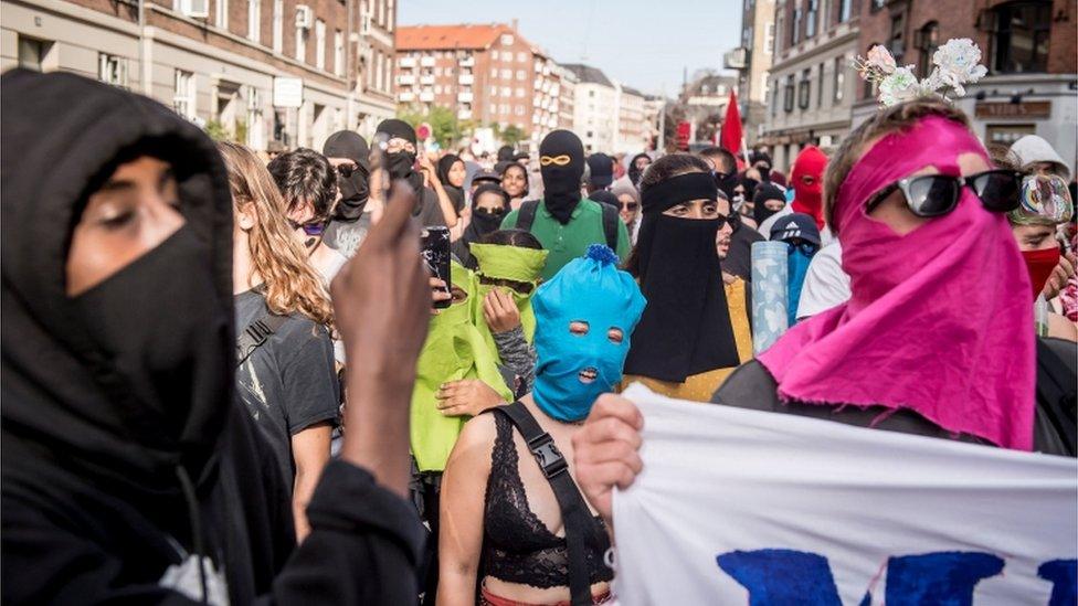 People of all backgrounds with makeshift coverings in Copenhagen