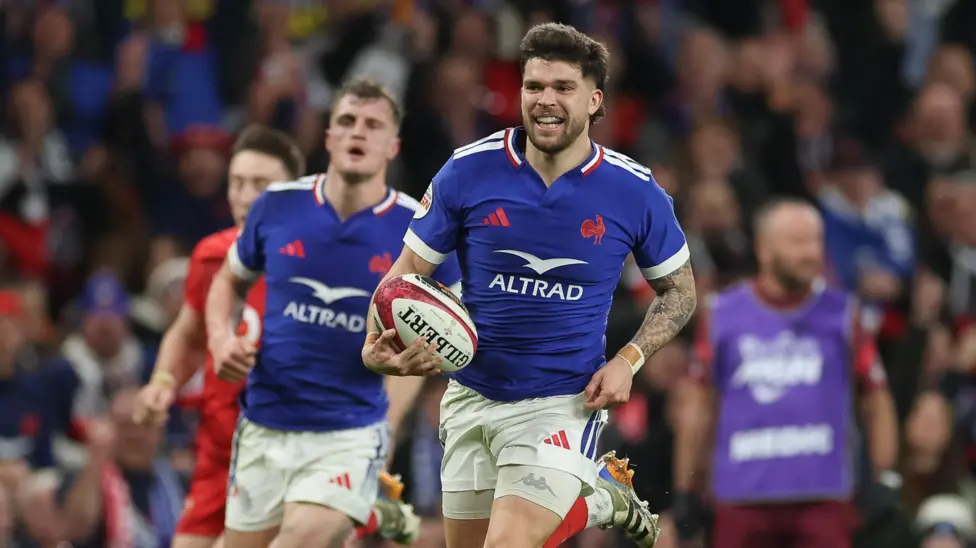 Matthieu Jalibert runs away to score France's fourth try against Wales in Cardiff