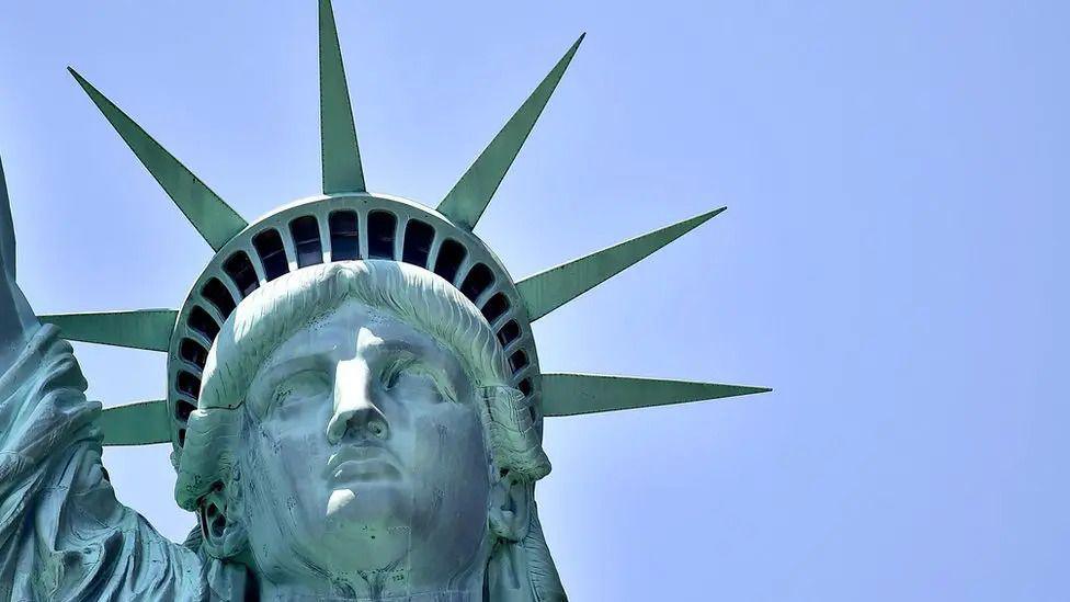a close up of the face of the Statue of Liberty.